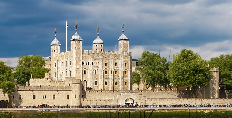 Tower of London with historic architecture and river view.