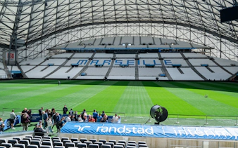 Guided tour group at the CEPAC Vélodrome in Marseille stadium.