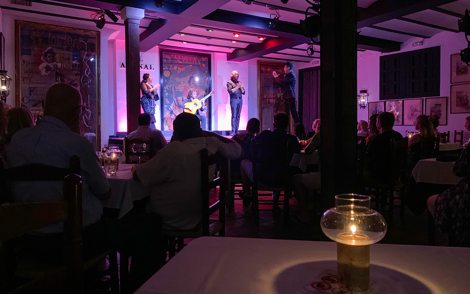 Flamenco performers on stage at Tablao El Arenal in Seville, Spain.