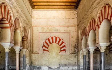 Interior arches and detailed wall design of Medina Azahara archaeological site.