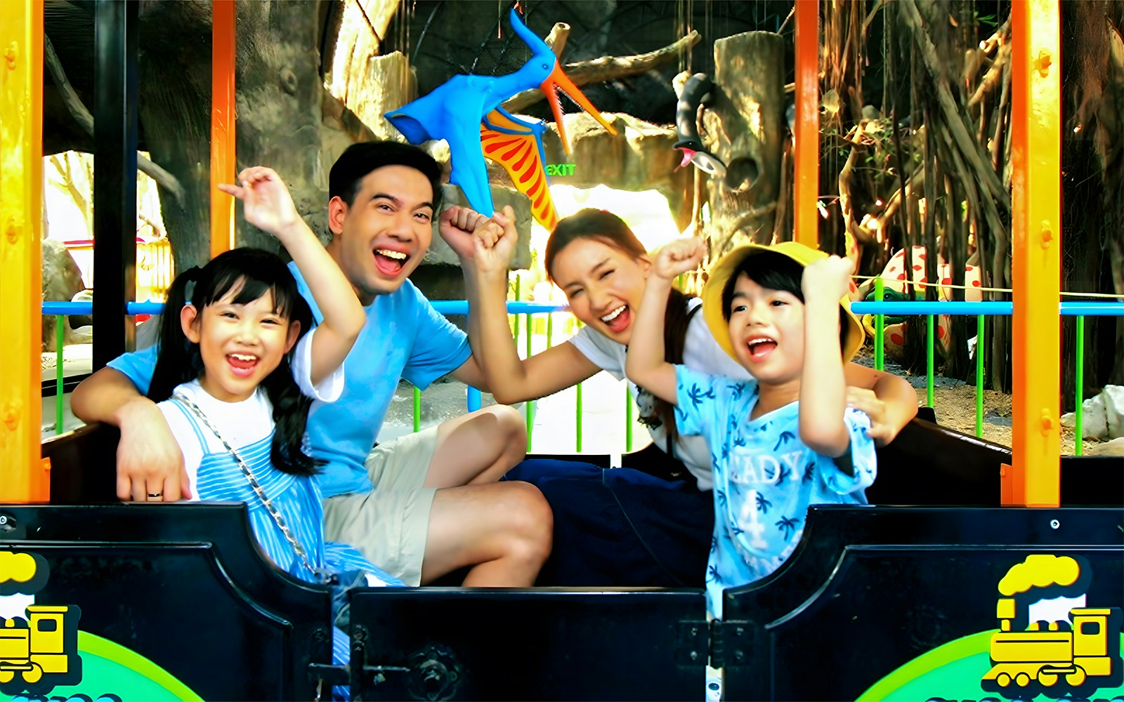 Family having fun on train rides at Siam Amazing Park, Bangkok.