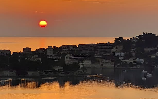 Sunset view over St Jean Cap Ferrat from a boat tour departing Nice.