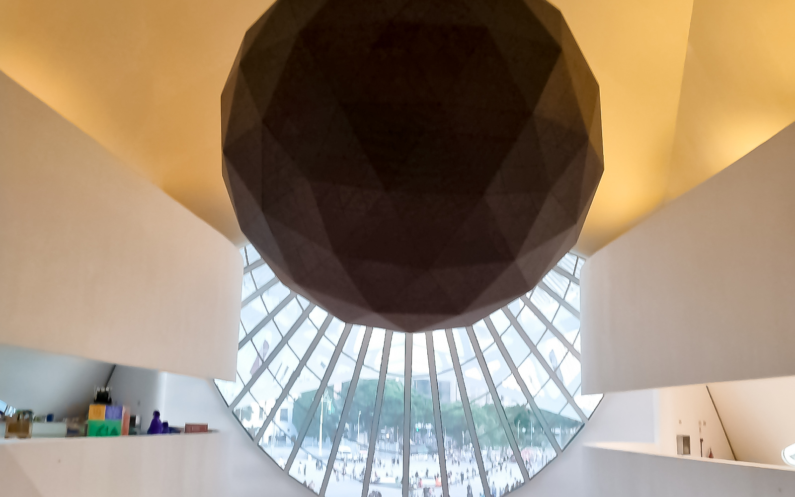 Futuristic interior with geometric object and fan-shaped stained glass at Museum of Tomorrow, Rio.