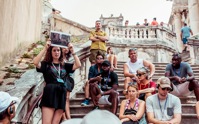Tour group with guide on Dubrovnik steps, Game of Thrones "Walk of Shame" location.