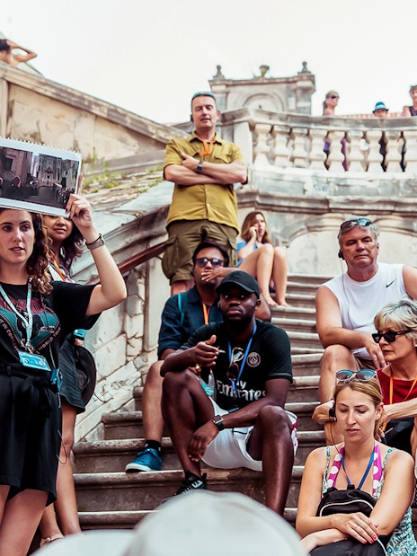 Tour group with guide on Dubrovnik steps, Game of Thrones "Walk of Shame" location.