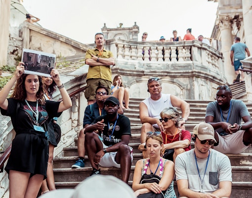 Tour group with guide on Dubrovnik steps, Game of Thrones "Walk of Shame" location.