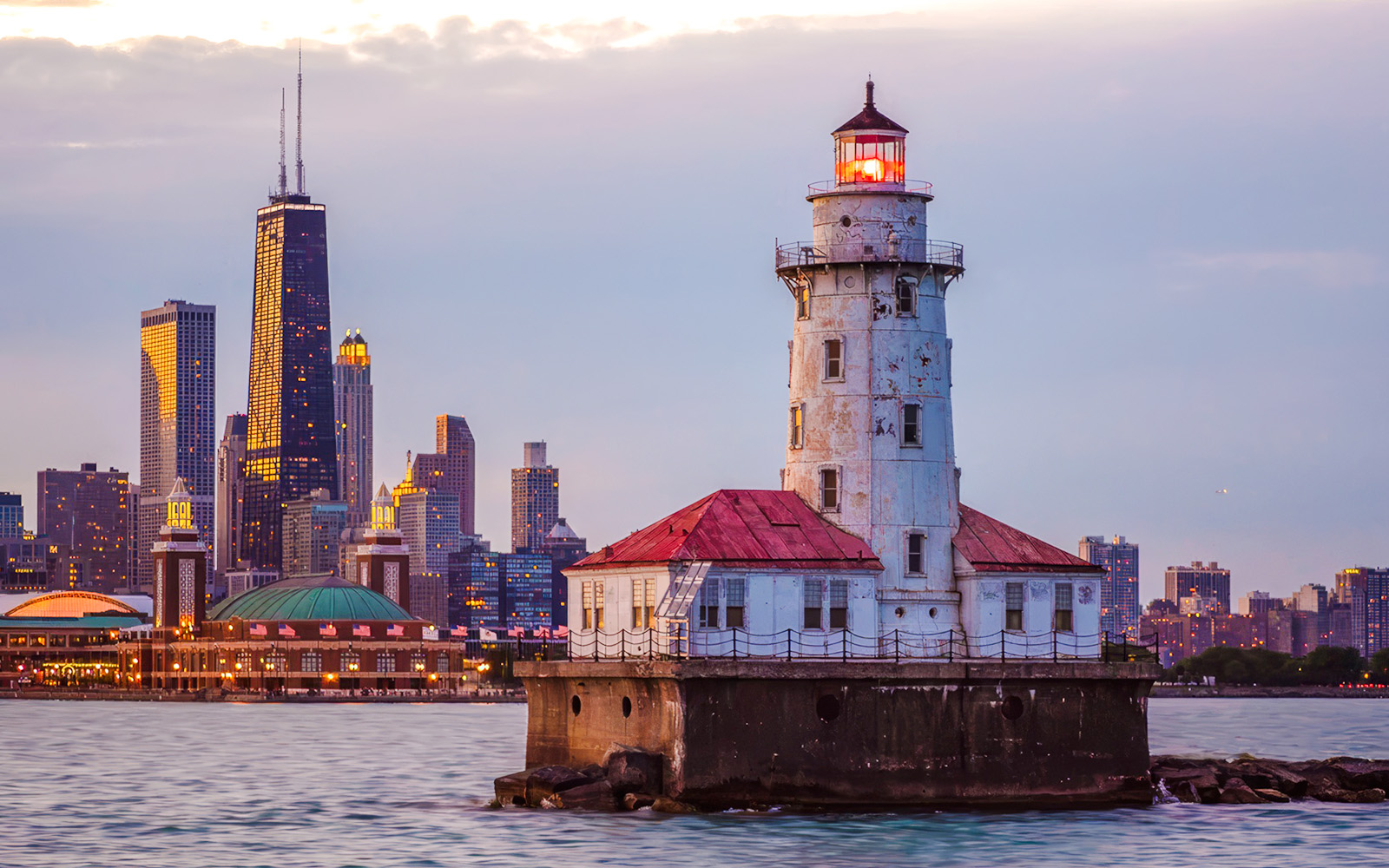 Chicago Harbor Lighthouse with city skyline during architecture tour.
