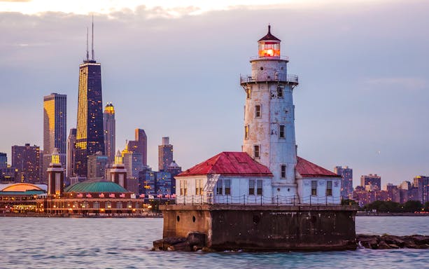 Chicago Harbor Lighthouse with city skyline during architecture tour.