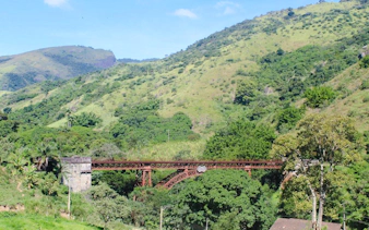 Historic railway bridge in lush Coffee Valley, Rio de Janeiro.