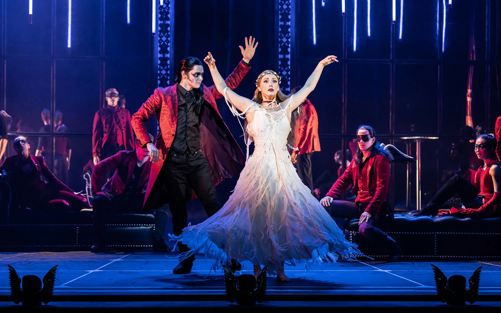 Dancers performing in Matthew Bourne's Sleeping Beauty with dramatic lighting and costumes.