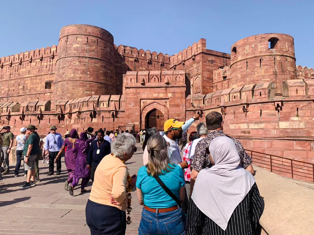 Tourists exploring Agra Fort during the Delhi to Agra tour.