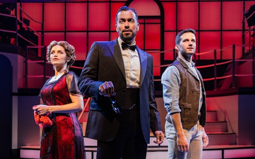 Performers on stage in a scene from the musical Titanique.