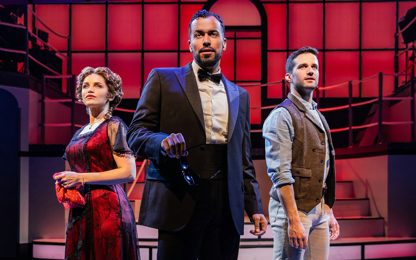 Performers on stage in a scene from the musical Titanique.