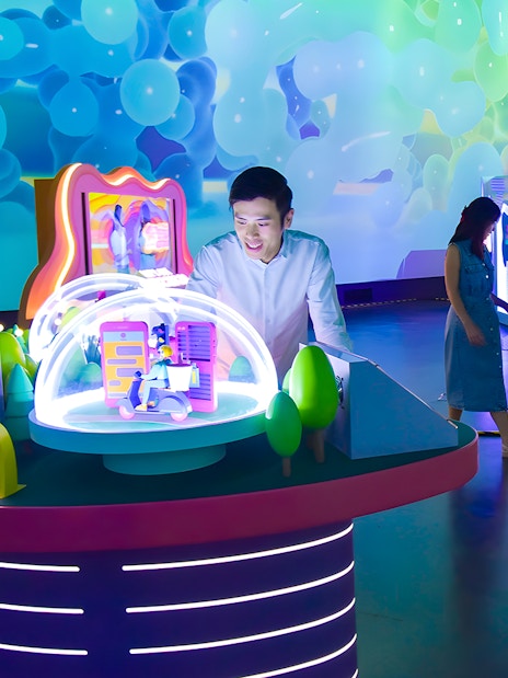 Interactive exhibit at Science Centre Singapore with colorful displays and visitors exploring.