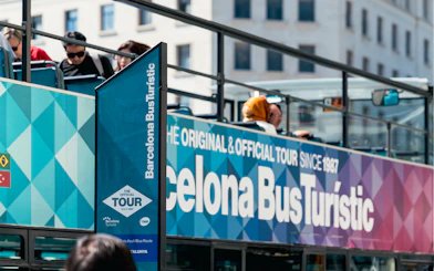Barcelona Bus Turistic with passengers on an open-top bus tour.