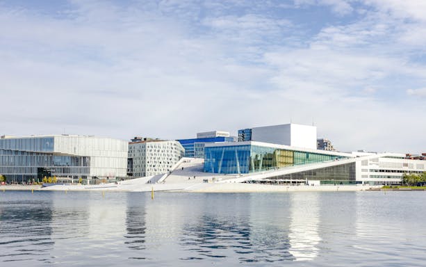 Oslo Opera House viewed from the water during a fjord sightseeing cruise.