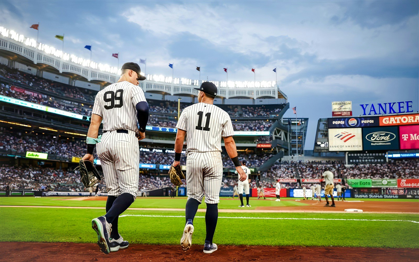 Crowd at Yankee Stadium with confetti falling during a night event.