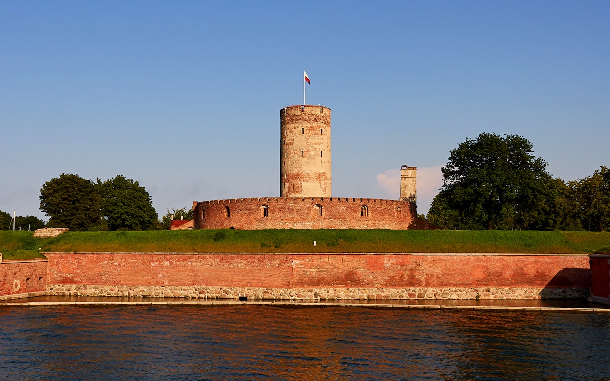 Gdansk River sunset view with historic fortress and Prosecco cruise.