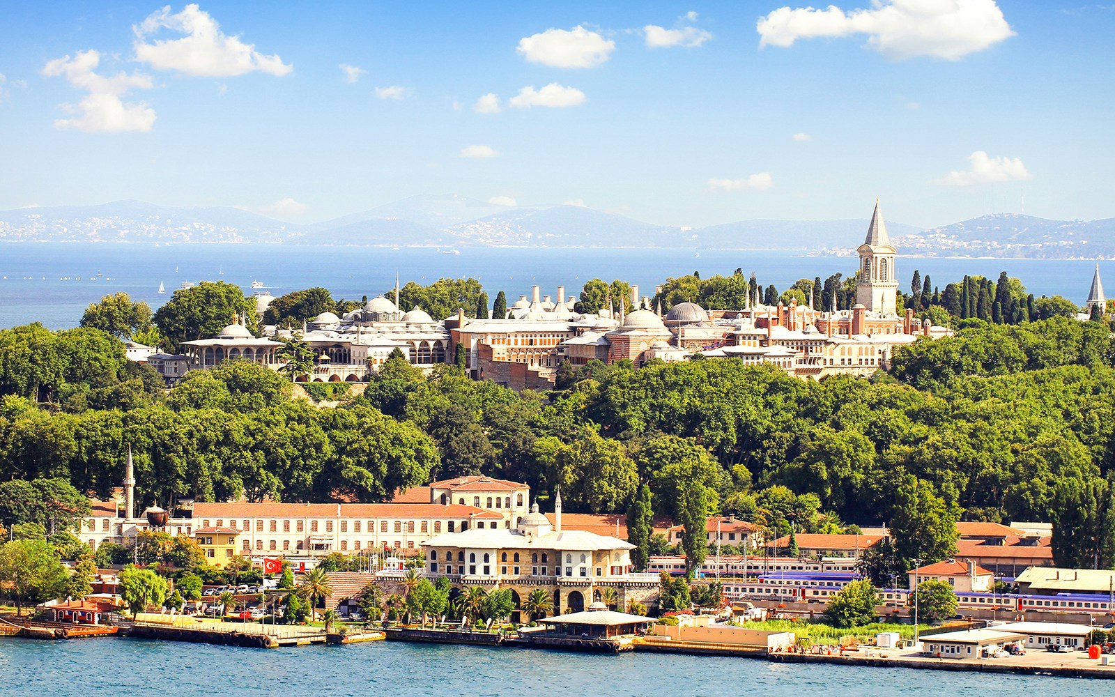 Topkapi Palace surrounded by lush greenery with the Bosphorus in the background, Istanbul.