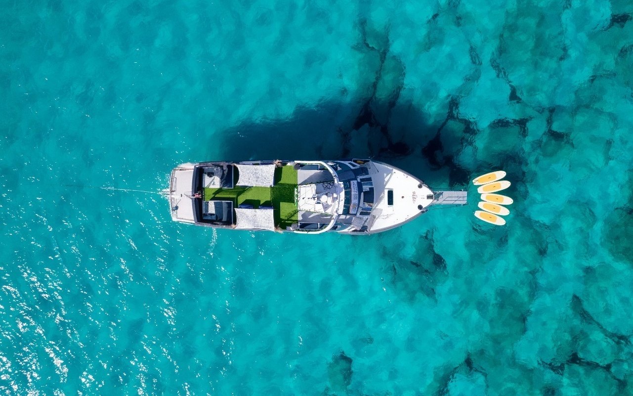 Cruise boat on turquoise waters during Formentera tour in Ibiza.