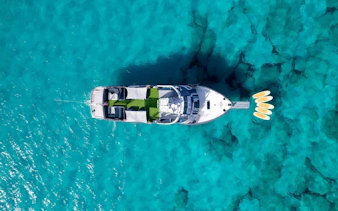 Cruise boat on turquoise waters during Formentera tour in Ibiza.