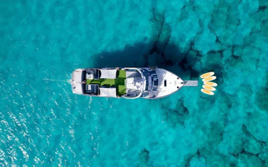 Cruise boat on turquoise waters during Formentera tour in Ibiza.