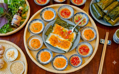 Traditional Vietnamese dishes with sauces on a Da Nang food tour.