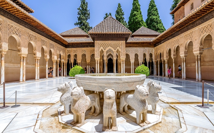 Court of the Lions fountain in Nasrid Palaces, Alhambra, Granada, Spain.