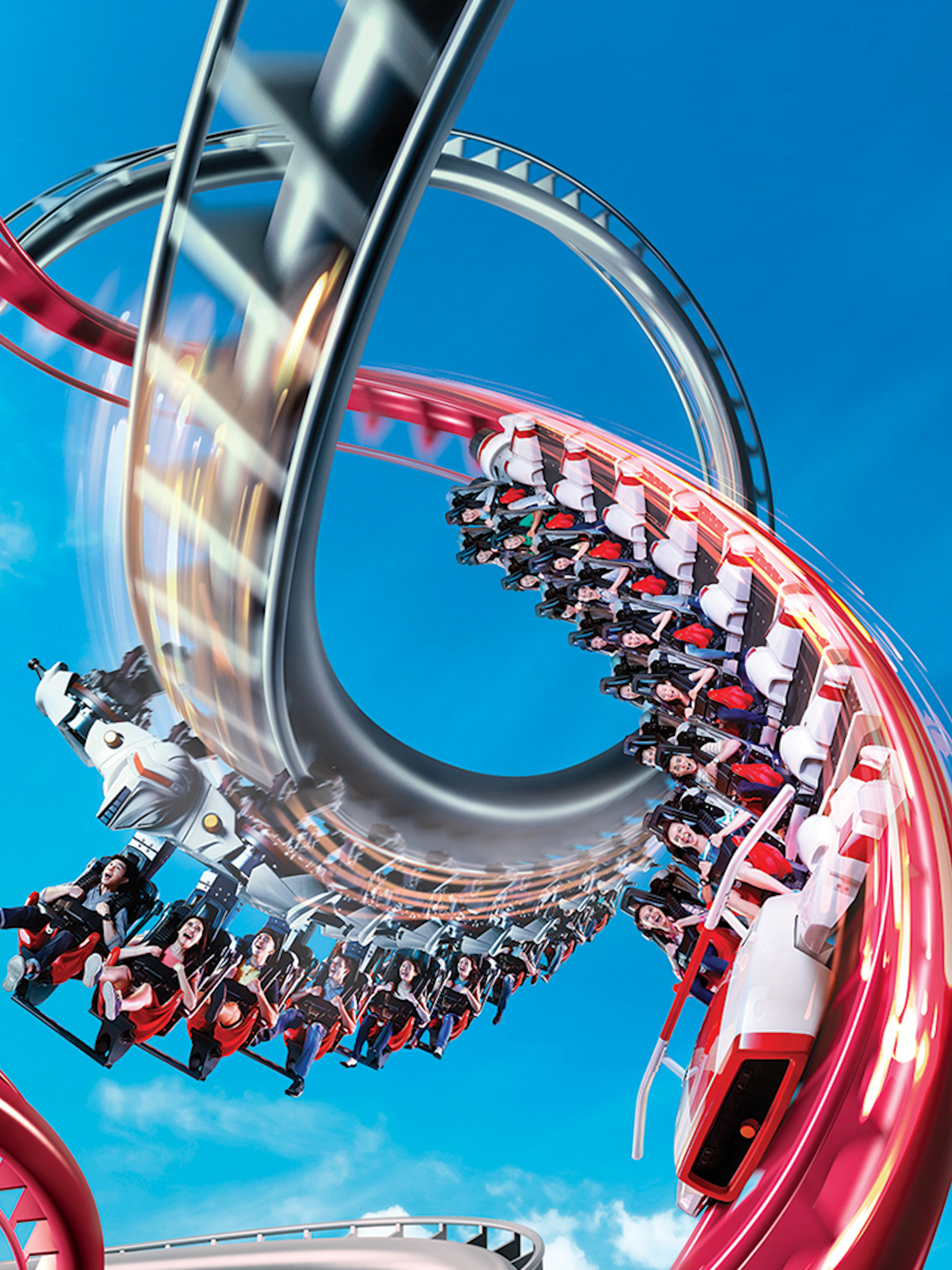Rollercoaster loop at Universal Studios Singapore against blue sky.