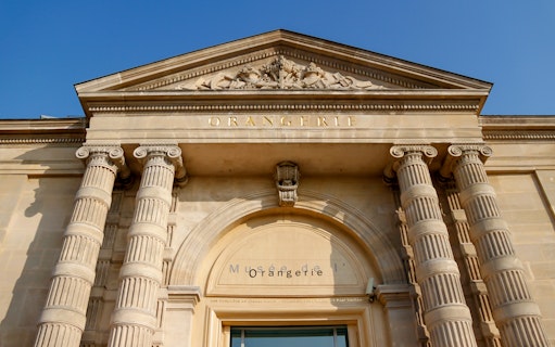 Exterior facade of the Orangerie Museum in Paris with classical columns.