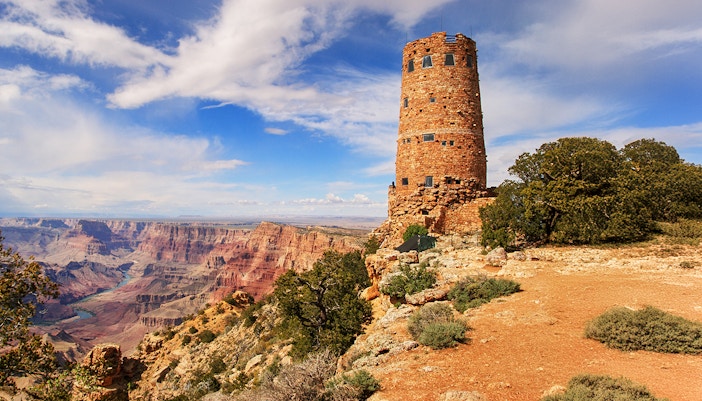 Tourists enjoying a scenic view from the Grand Canyon South Rim Bus tour in Las Vegas