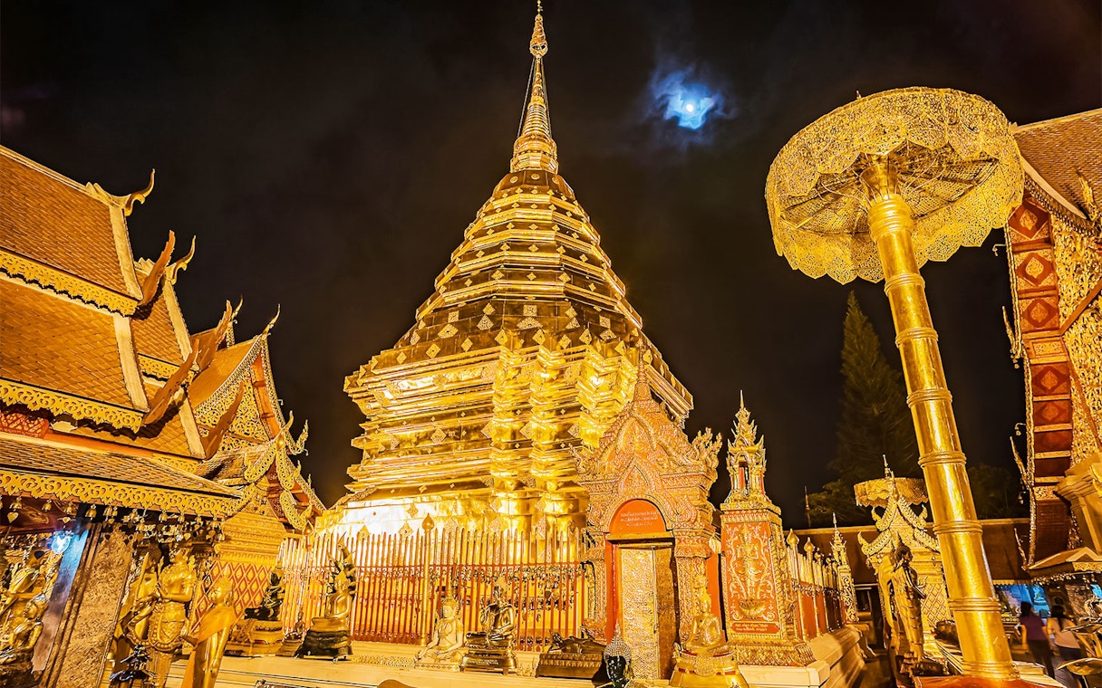 Pagoda at Doi Suthep temple illuminated at night, Chiang Mai, Thailand.