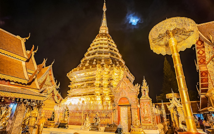 Pagoda at Doi Suthep temple illuminated at night, Chiang Mai, Thailand.