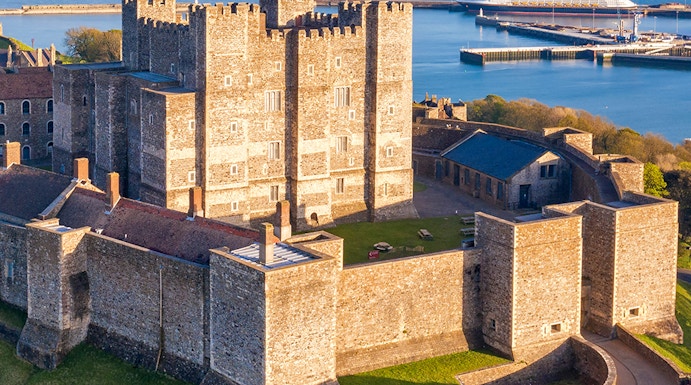 Dover Castle overlooking the English Channel with a cruise ship in the background.