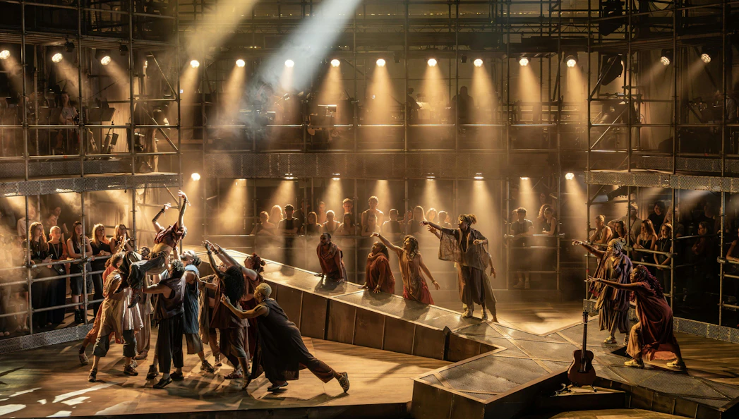 Stage scene from Jesus Christ Superstar, West End, with actors performing under dramatic lighting.