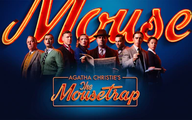 Cast of Agatha Christie's The Mousetrap holding a newspaper against a neon sign backdrop.