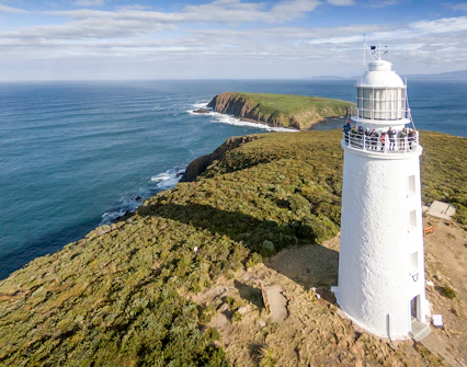 Cape Bruny Lighthouse overlooking the ocean, part of the Cape Bruny Lighthouse Tour.
