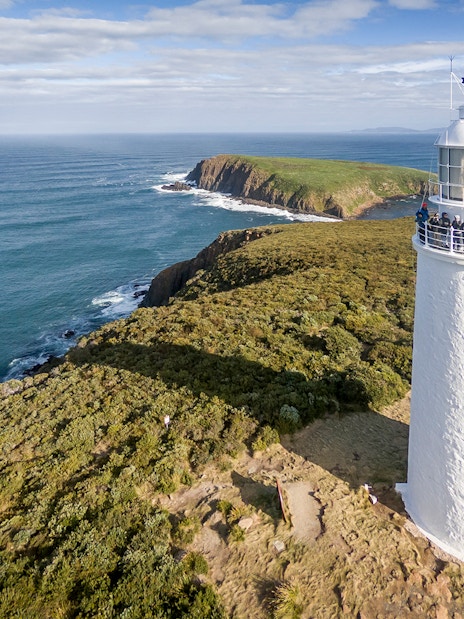 Cape Bruny Lighthouse overlooking the ocean, part of the Cape Bruny Lighthouse Tour.