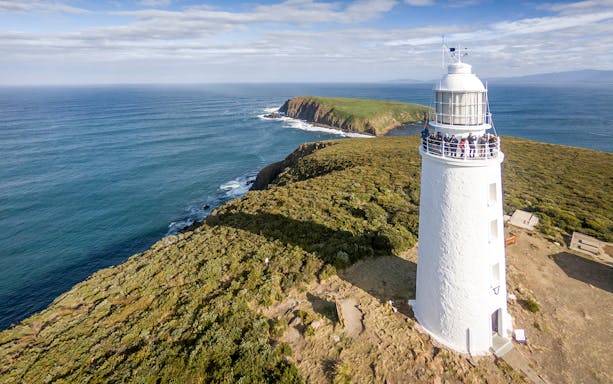 Cape Bruny Lighthouse overlooking the ocean, part of the Cape Bruny Lighthouse Tour.