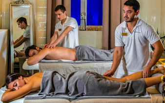 Couples receiving massages at Pesterzsebet Bath, Budapest.