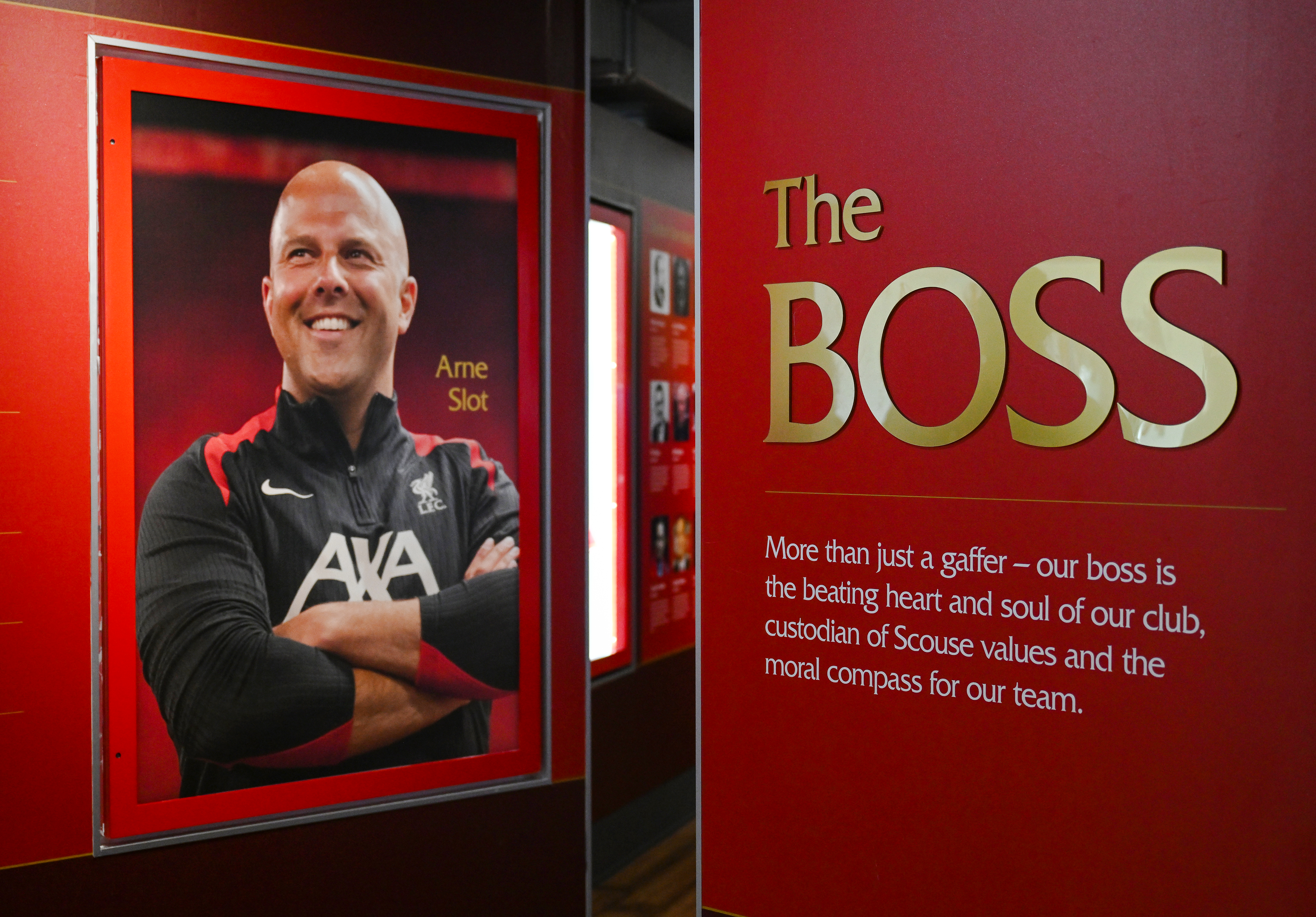 Portrait and tribute to a Liverpool FC figure inside Anfield Stadium.