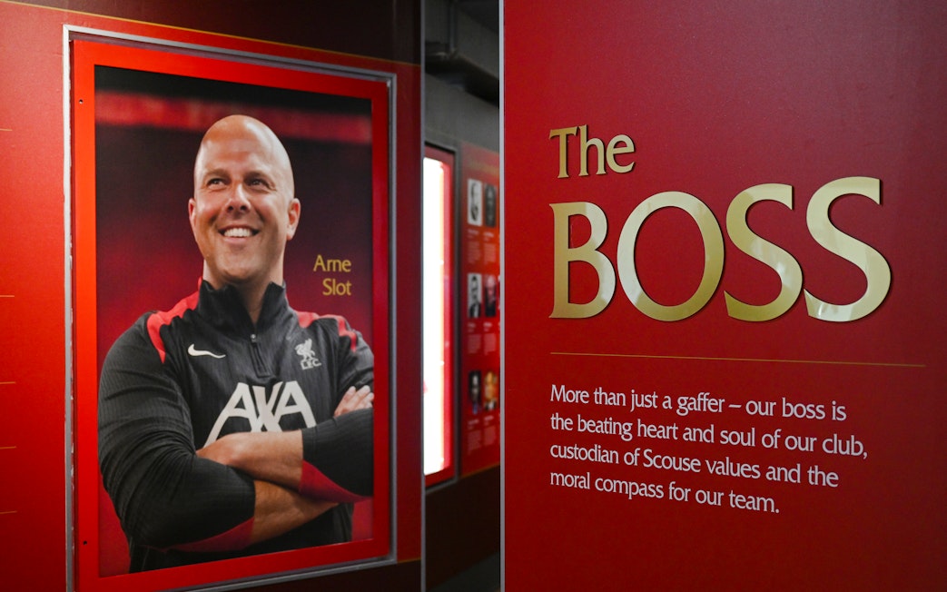 Portrait and tribute to a Liverpool FC figure inside Anfield Stadium.