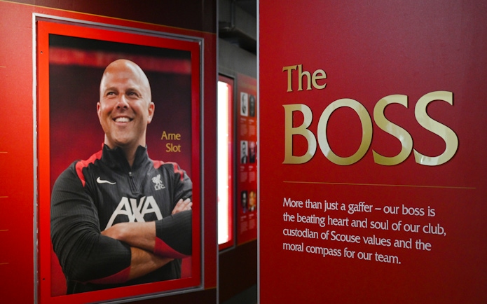 Portrait and tribute to a Liverpool FC figure inside Anfield Stadium.
