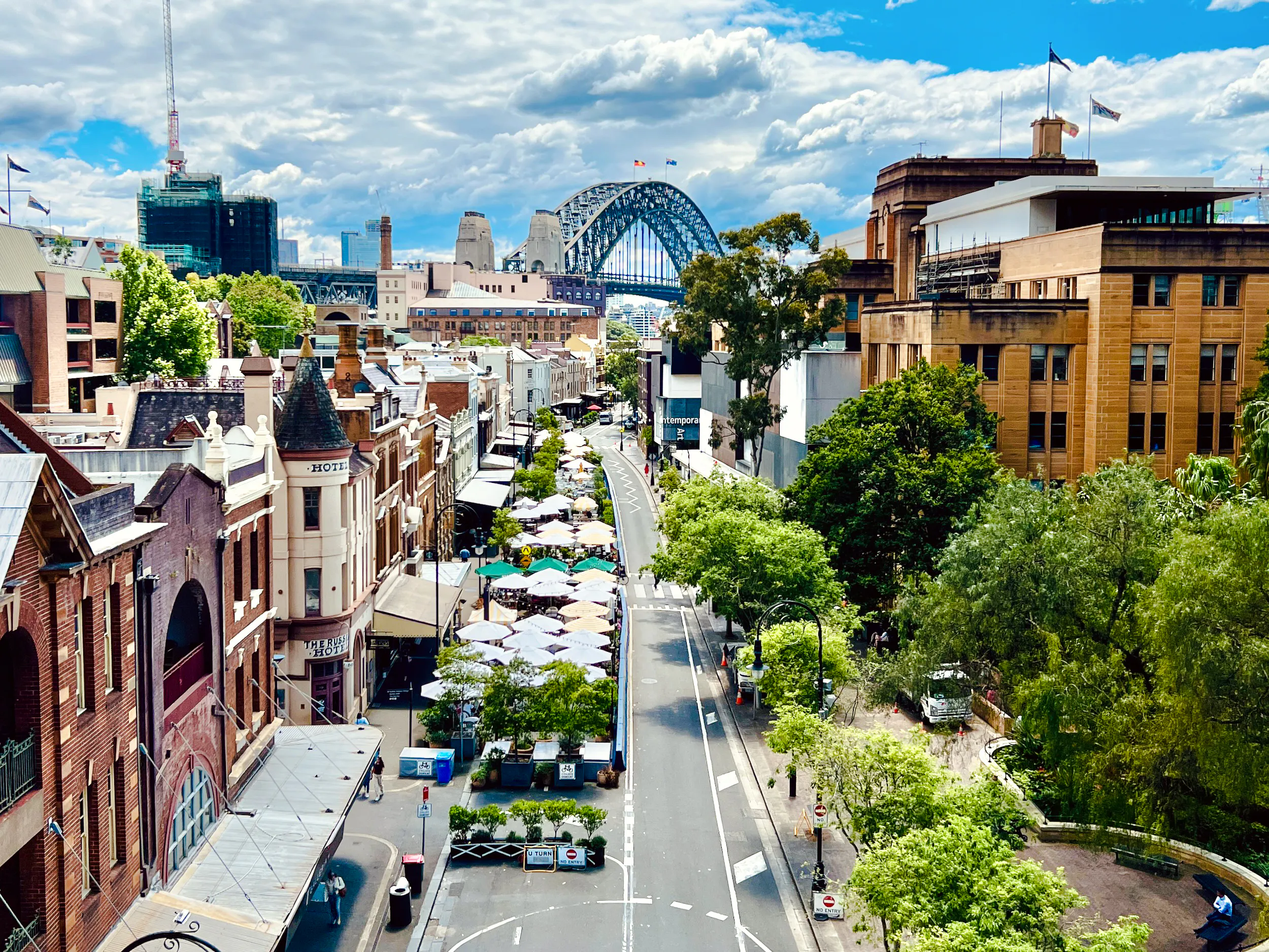 Historic street view with cafes and Sydney Harbour Bridge in the background, Sydney.