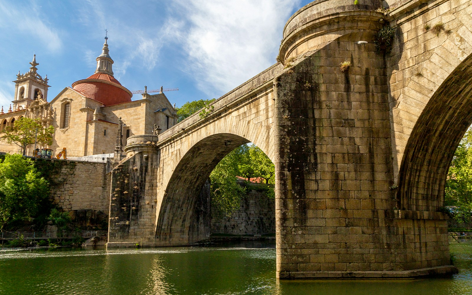 Bridge and Church of São Gonçalo in Amarante, Portugal, with river view.