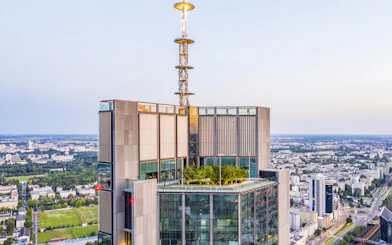 Highline Warsaw rooftop terrace with cityscape view and greenery.