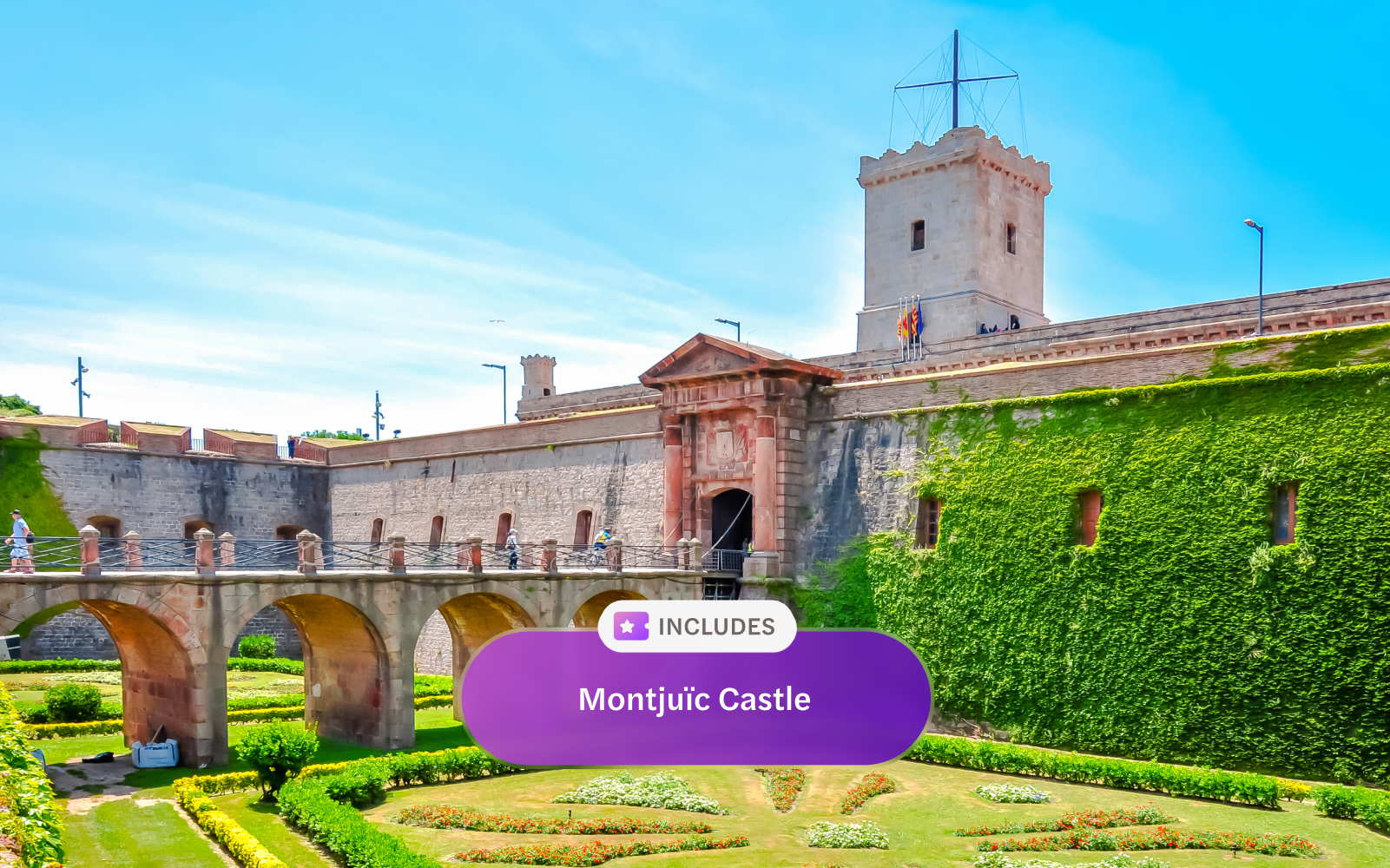 Fortress of Montjuic with stone bridge and lush gardens, Barcelona, Spain.