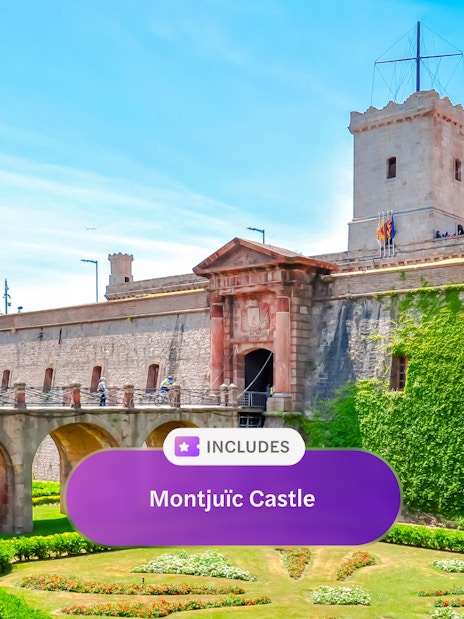 Fortress of Montjuic with stone bridge and lush gardens, Barcelona, Spain.
