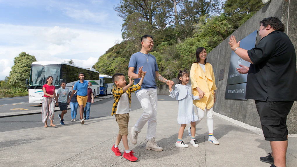 Tour group arriving at Hobbiton Movie Set visitor center, Auckland.