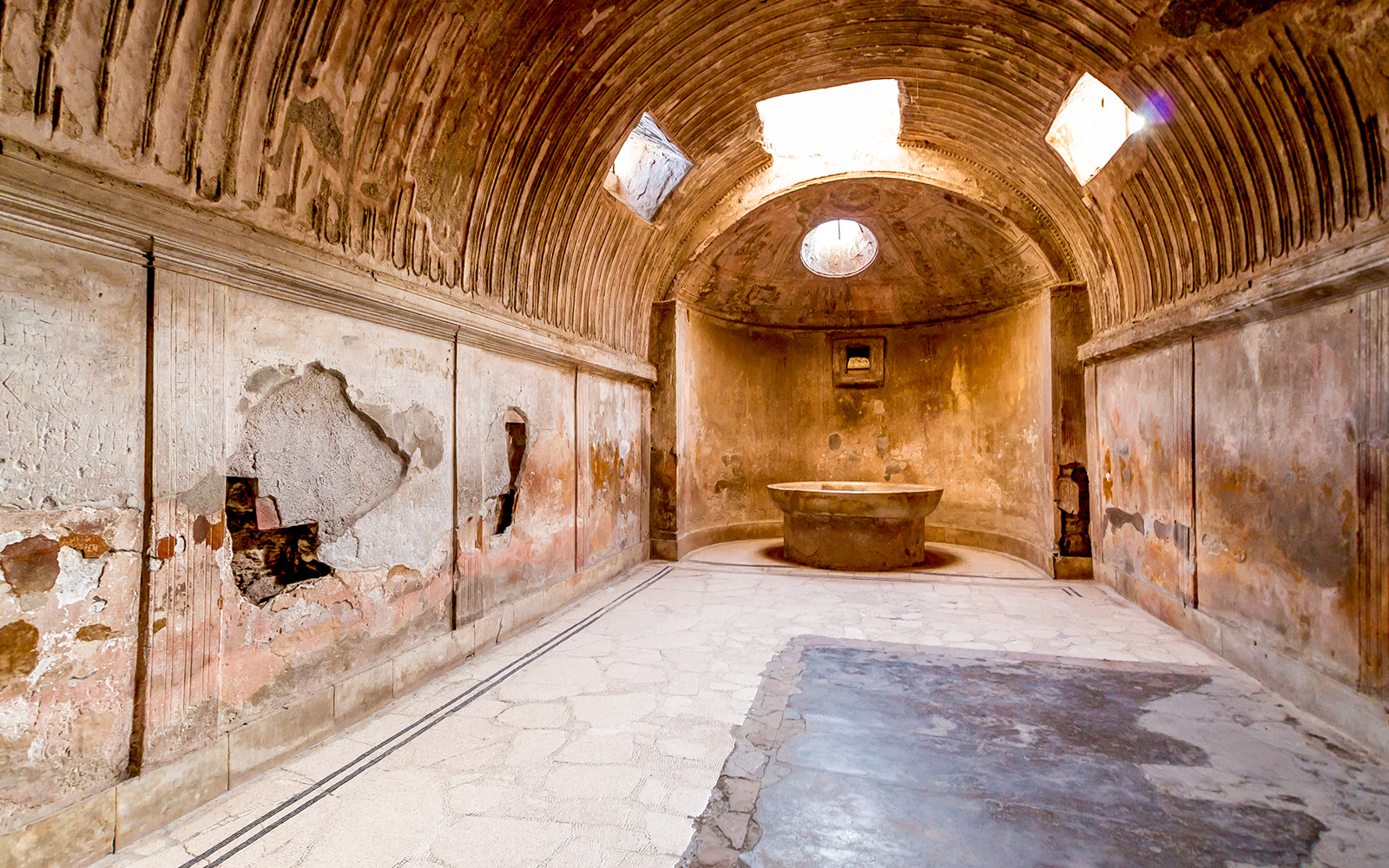Ancient bathhouse interior in Pompeii on a 2-hour private guided tour.